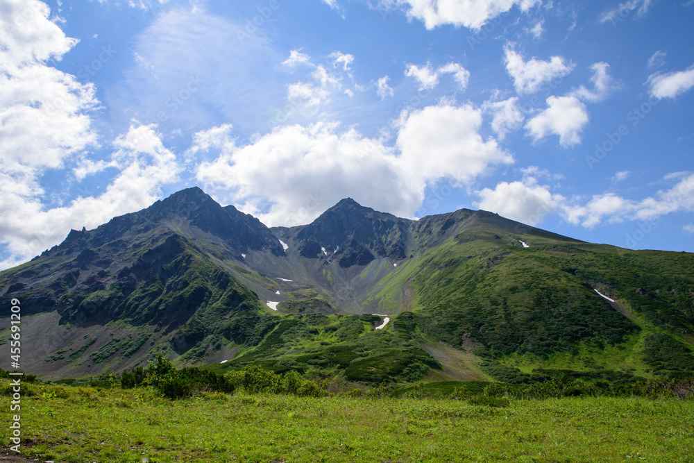 Landscape. A mountain range around the crater of an ancient volcano. Vachkazhets volcano. Kamchatka Peninsula