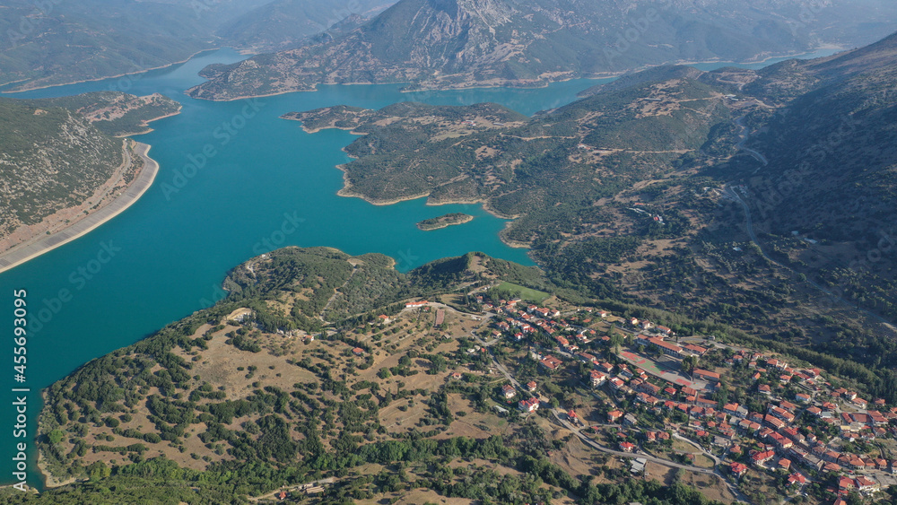 Aerial drone photo of small picturesque village of Lidoriki built near lake and dam of Mornos a clean water supply for Attica, Greece