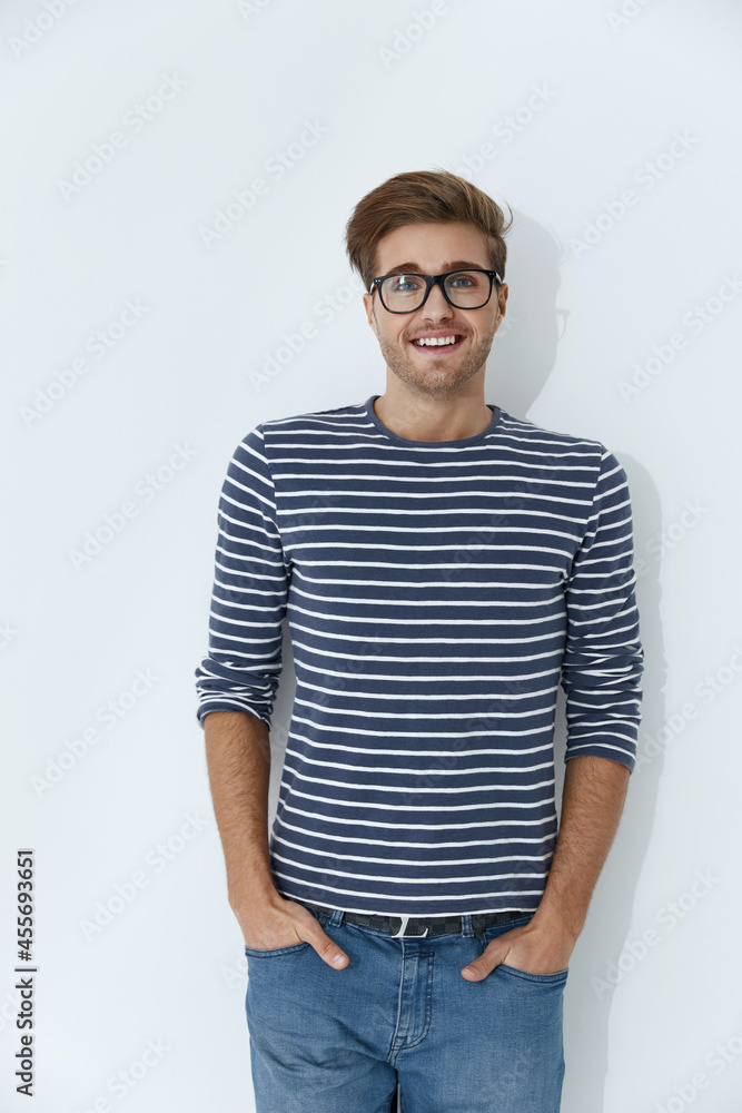 Young smiling european man with hands in pockets Young smiling european man with hands in pockets