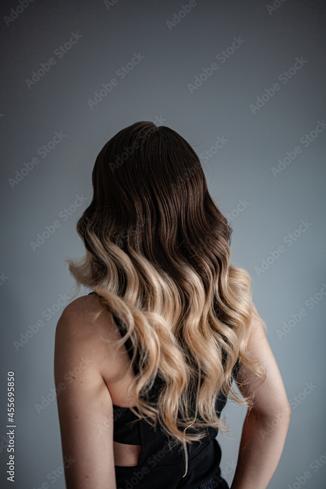 stylist hairdresser makes a hairstyle for a girl in his beauty salon, hollywood wave, beautiful hairstyle, hairdresser at work stylist hairdresser makes a hairstyle for a girl in his beauty salon, hollywood wave, beautiful hairstyle, hairdresser at work