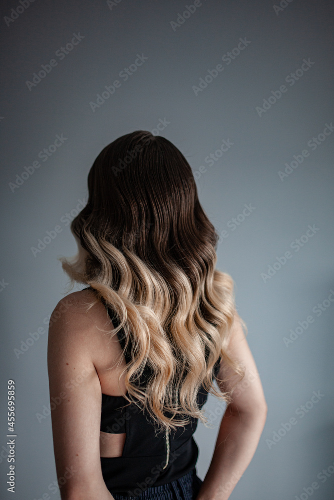 stylist hairdresser makes a hairstyle for a girl in his beauty salon, hollywood wave, beautiful hairstyle, hairdresser at work stylist hairdresser makes a hairstyle for a girl in his beauty salon, hollywood wave, beautiful hairstyle, hairdresser at work