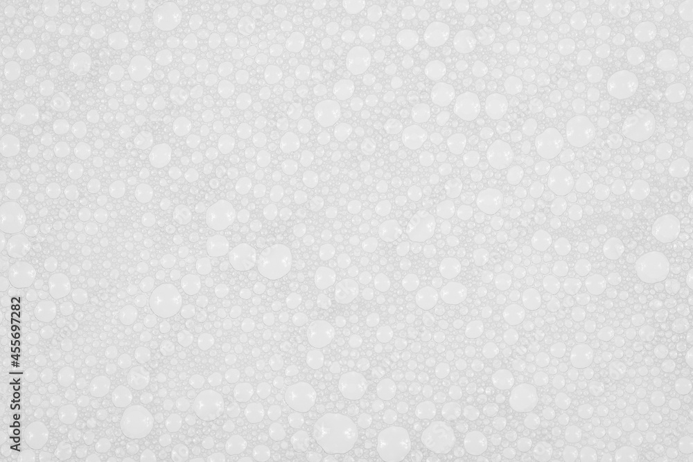 Texture of small soap bubbles on water background. foam Texture of small soap bubbles on water background. foam
