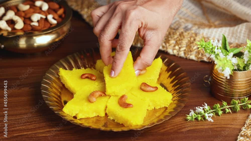 woman eating Rava kesari Kesari bath sheera suji halwa Indian sweet