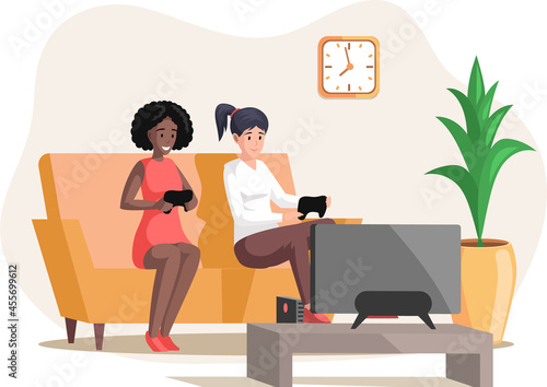 Girls playing video games sitting on couch with gamepad relaxing at home alone. Living room interior design and furniture arrangement in apartment. Fun leisure time with friends, entertainments