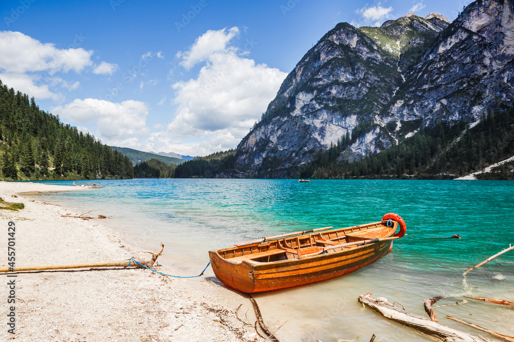 Lago di Braies in Dolomites, mountains forest trail in background, Sudtirol, Italy Lago di Braies in Dolomites, mountains forest trail in background, Sudtirol, Italy
