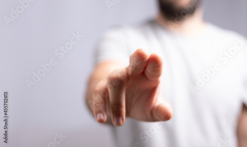 Hand pushing on a touch scr...