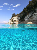 Underwater sea level split photo of beautiful paradise turquoise exotic beach of Voutoumi probably the best in Greece, Ionian island of Antipaxos
