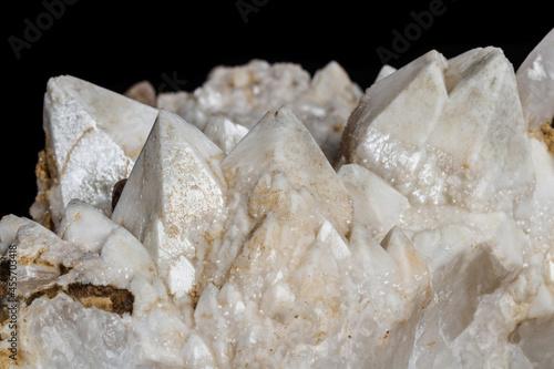 Macro mineral stone Snow quartz with calcite on a black background