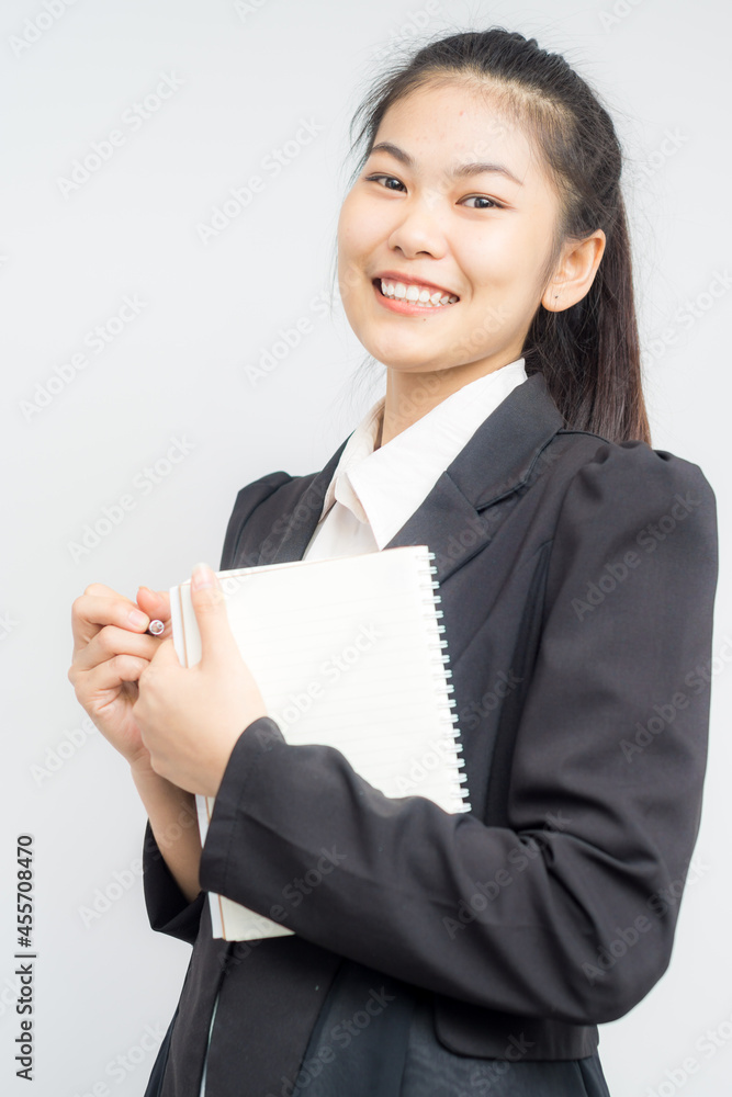 Attractive business asian women gesture hand with pen and book Attractive business asian women gesture hand with pen and book