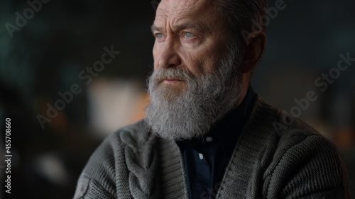 Thoughtful senior man portrait. Focused elderly man thinking about life 