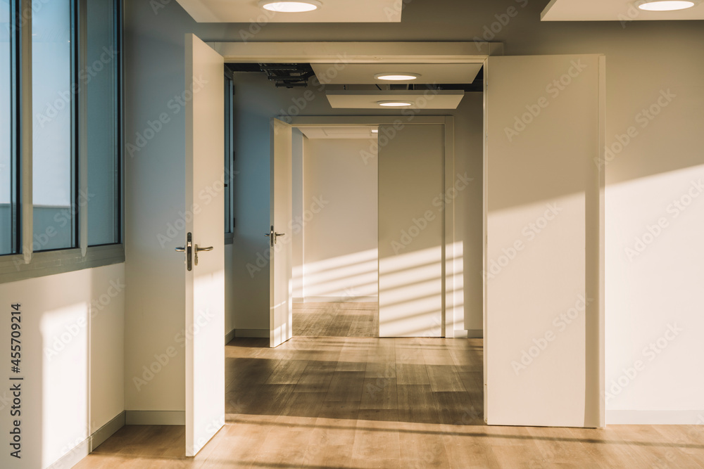 Empty office hall lit by sunlight Empty office hall lit by sunlight