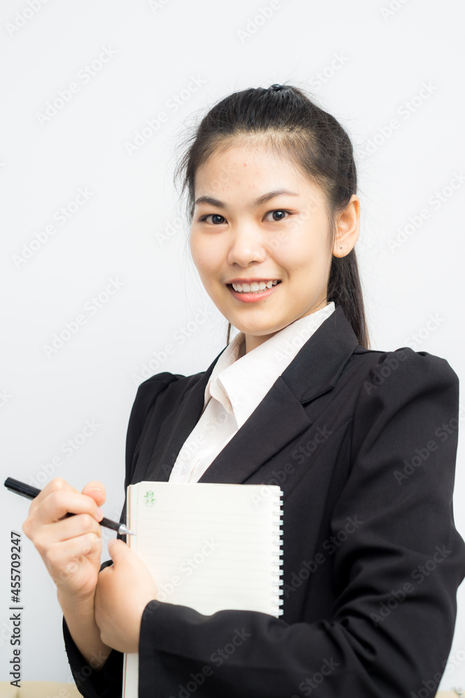 Attractive business asian women gesture hand with pen and book Attractive business asian women gesture hand with pen and book