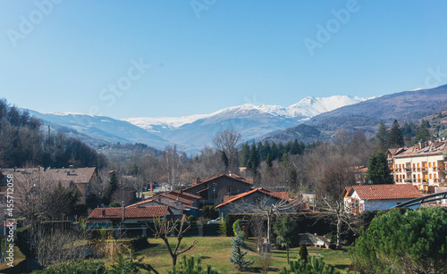 Picture of Camprodon village with some houses and Spanish Pyrenees at the bottom. photo