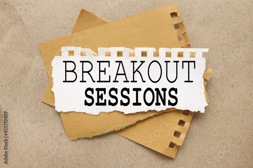 Breakout Session. white torn paper with text on brown background