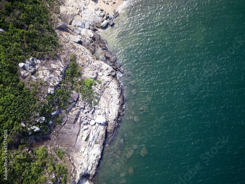 Aerial drone photo of a rocky coastline and sea in Hong Kong