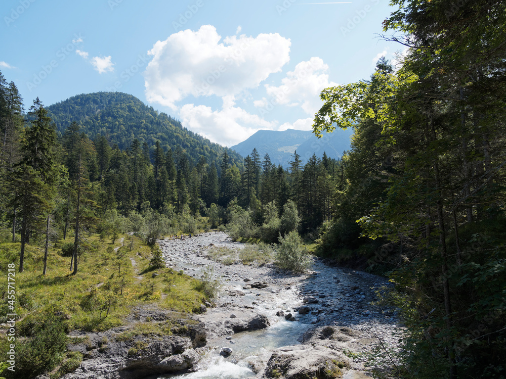 Upper Bavaria. Weißach river and small cascade in Kreuther Tal between Bavarian forest at foot of mangfall mountains near Tegernsee Upper Bavaria. Weißach river and small cascade in Kreuther Tal between Bavarian forest at foot of mangfall mountains near Tegernsee