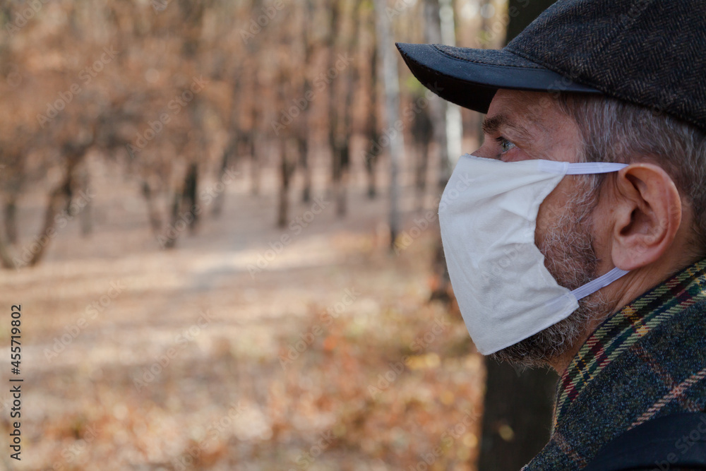 Man in protective mask in nature
