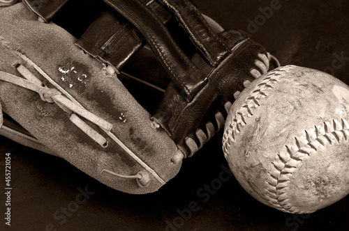 Old Softball with Glove Monochrome on Dark Background