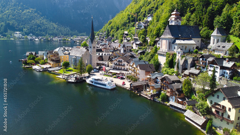 Hallstatt, Austria. Aerial view of the beautiful town from a flying drone over the lake in summer season.