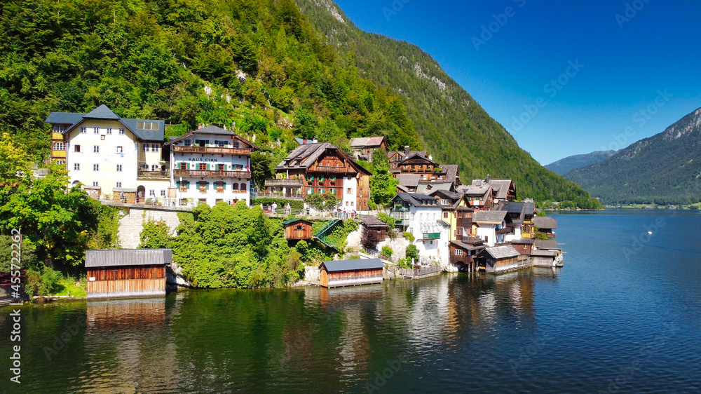 Hallstatt, Austria. Aerial view of the beautiful town from a flying drone over the lake in summer season.