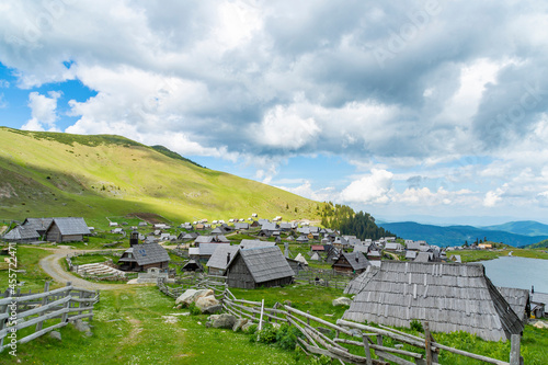 Amazing countryside landscape with small cottages beside a the lake and surrounded with green mountain peaks. Prokosko lake on mountain Vranica in Bosnia and Herzegovina is famous for nature lovers.