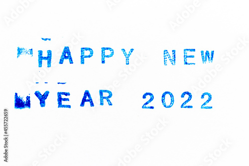 Blue color ink of rubber stamp in word happy new year 2022 on white paper background