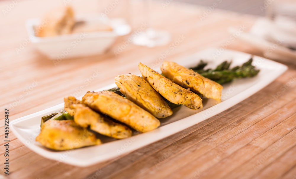 dietary meal rich in protein. Stir fried chicken breast and green asparagus dietary meal rich in protein. Stir fried chicken breast and green asparagus