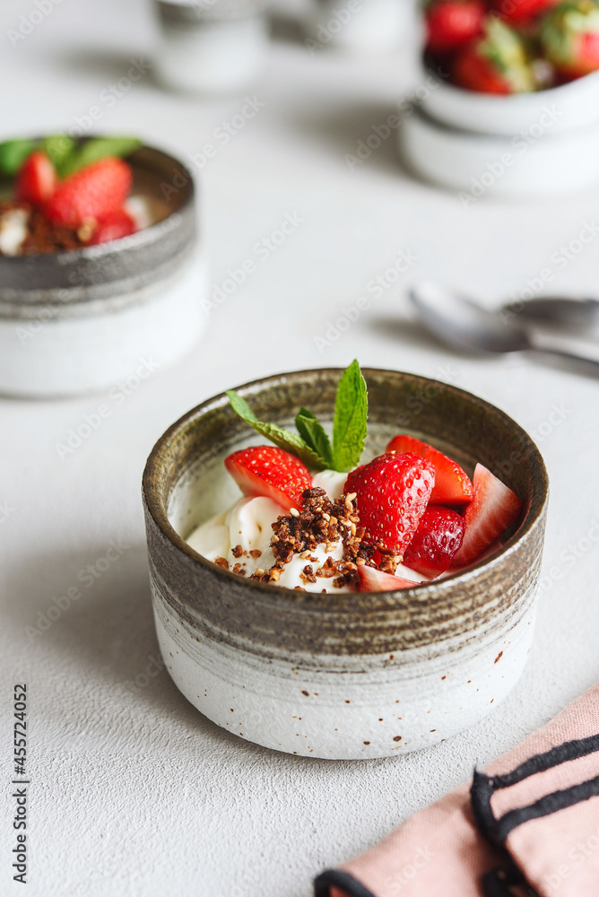 Strawberry, cream cheese and feta cream and crumble crust dessert. Homemade Sweet and salty cheesecake. Trifle. Selective focus Strawberry, cream cheese and feta cream and crumble crust dessert. Homemade Sweet and salty cheesecake. Trifle. Selective focus