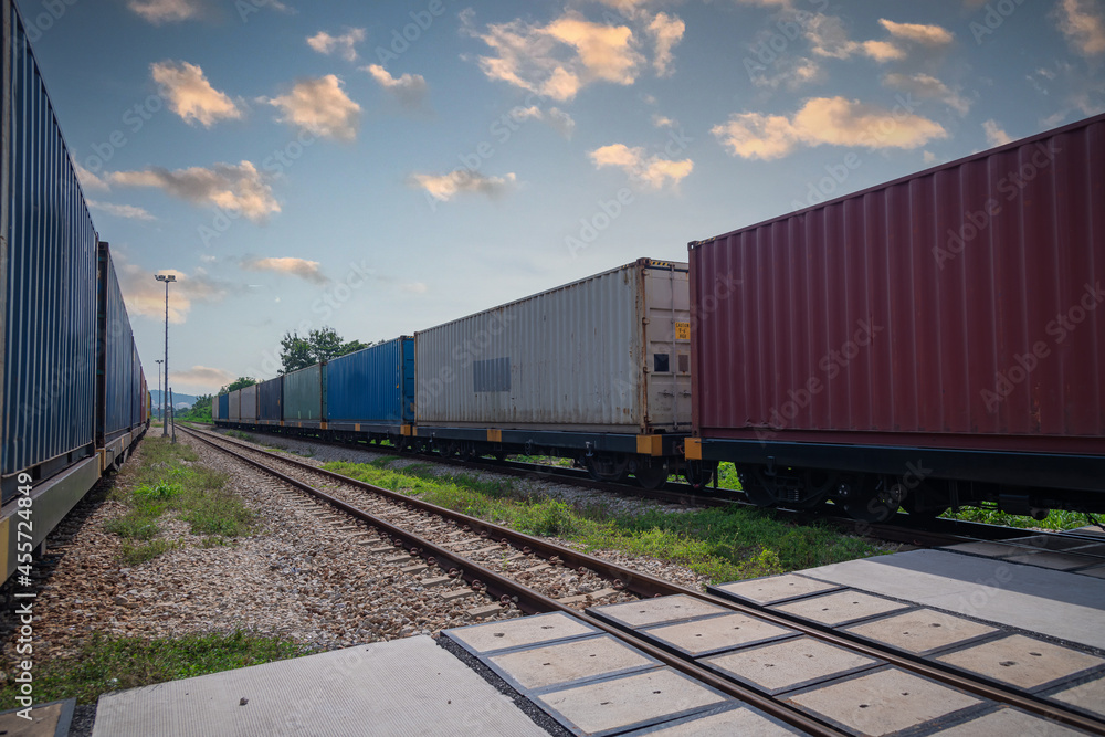 Train with container cargo boxes at railway station transport logistic distribution goods is industry business concept. Train with container cargo boxes at railway station transport logistic distribution goods is industry business concept.