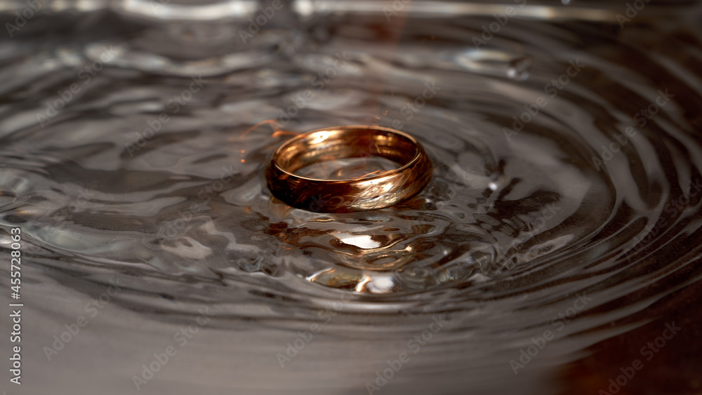 Gold ring with a pattern in a dark dialect