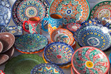 bright set of Uzbek dishes - bowls, jugs and a large plate