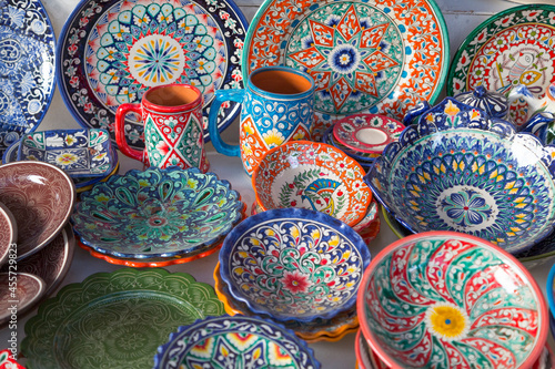 bright set of Uzbek dishes - bowls, jugs and a large plate