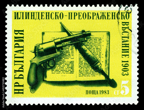 Postage stamp. Pistol and dagger. photo