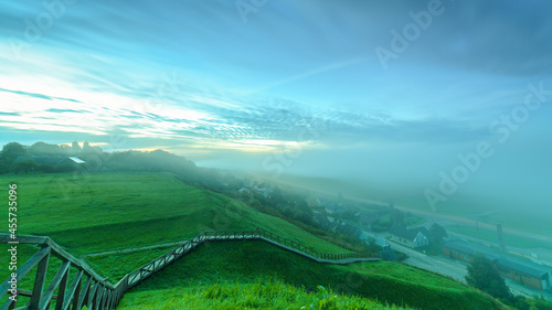 Wonderful autumn morning on the mound of Seredge. View of the Nemunas River drowned in fog. photo