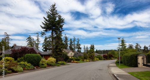 Street in a Residential Neighborhood with luxury homes. Sidney, Victoria, Vancouver Island, British Columbia, Canada. © edb3_16