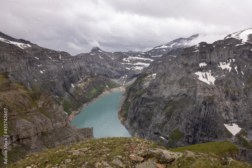 Amazing alpine lake called Limmerensee in the heart of canton Glarus in Switzerland. Epic view from the top of the mountain. Wonderful hiking day with good weather conditions.