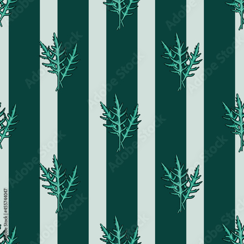 Seamless pattern bunch arugula salad on teal srtipes background. Modern ornament with lettuce.