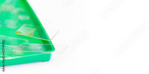 Microscopy and used laboratory glasses for the microscope are on a green tray after the study. results of clinical trials. laboratory studies of drugs, blood and vaccines