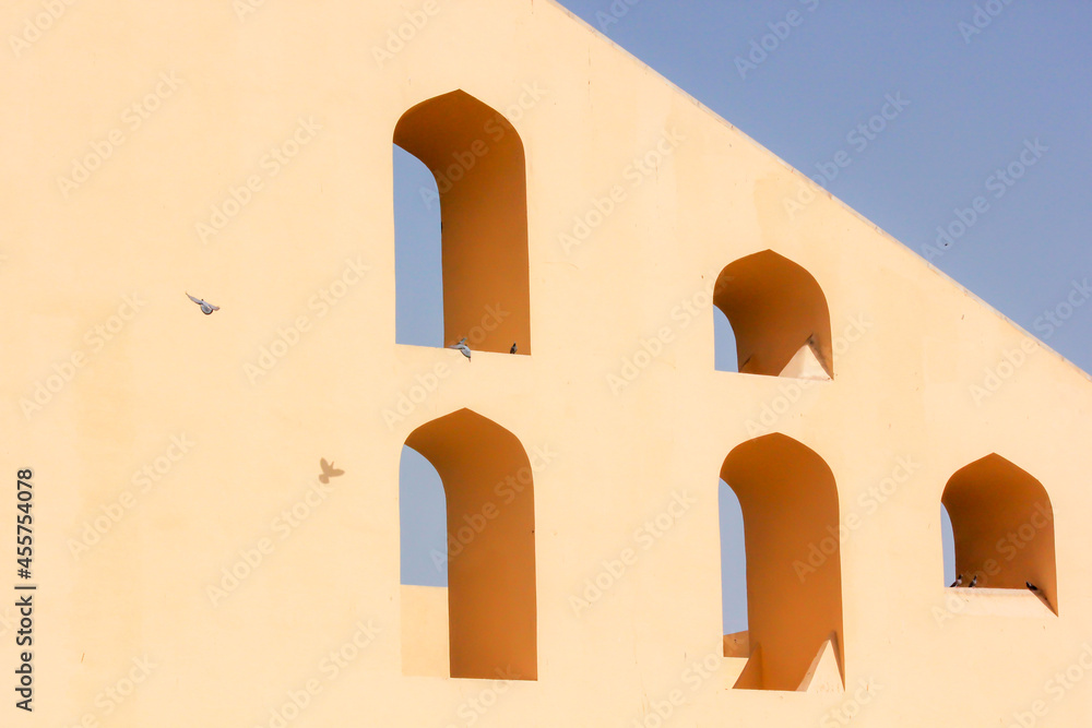 The abstract geometric patterns of the arched windows of the ancient ...