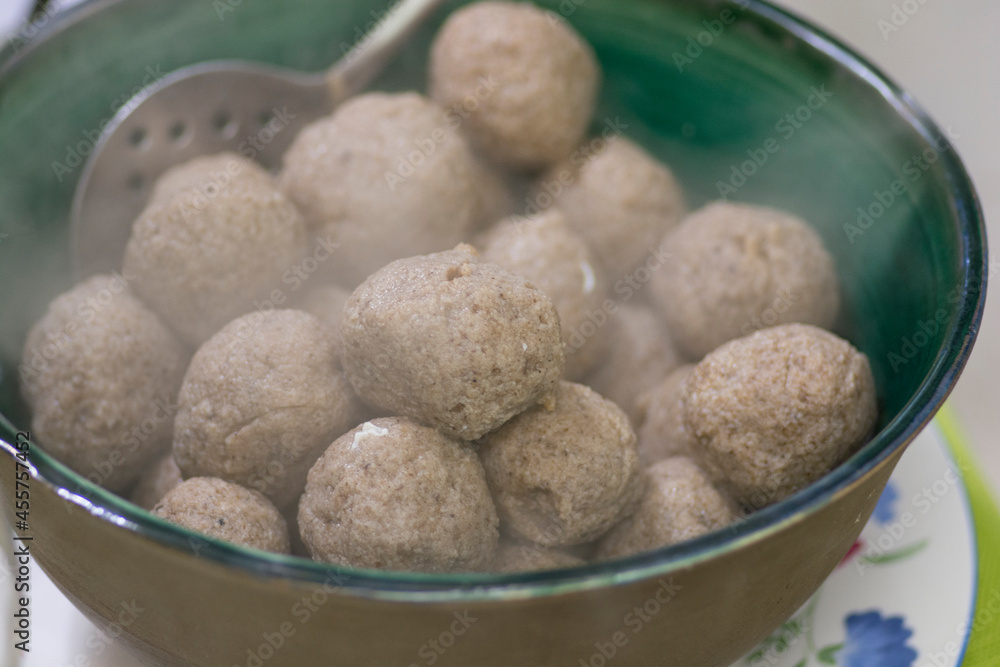 A bowl of Matzah balls, or matzo balls, Ashkenazi Jewish soup dumplings, traditionally eaten in the Jewish holiday of Passover A bowl of Matzah balls, or matzo balls, Ashkenazi Jewish soup dumplings, traditionally eaten in the Jewish holiday of Passover