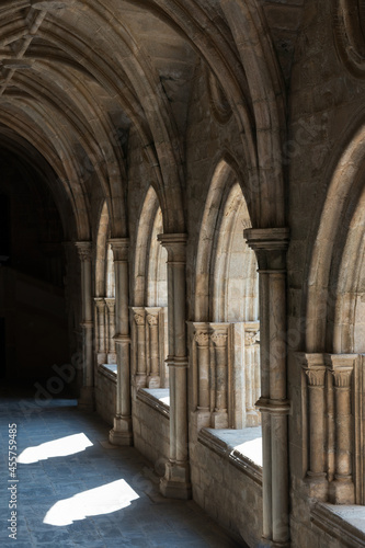 Beautiful cloister at Evora Cathedral. Stone arches, gothic style. Portugal, Europe