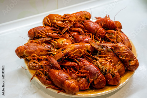 Delicious boiled crayfish/crawfish on a plate on a kitchen