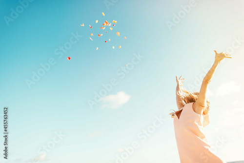 Woman throwing flower petals