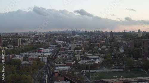 Aerial slow dolly shot during sunset with city 