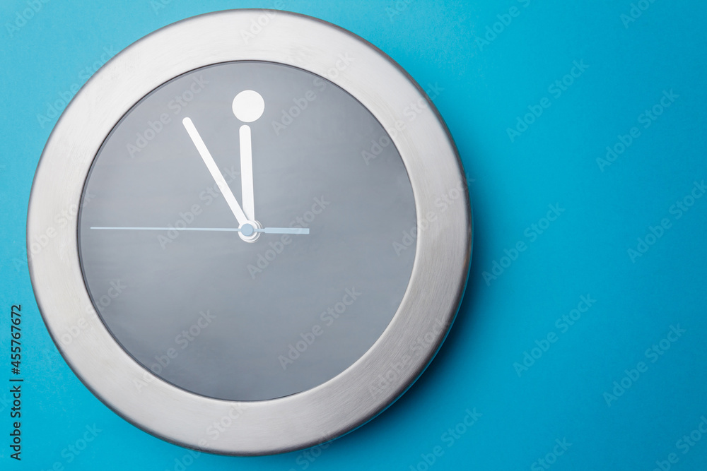 Lunch break time. Time for Lunch. The concept of black and gray clock - lunch. Clock on turquoise background. Space for text. Lunch break time. Time for Lunch. The concept of black and gray clock - lunch. Clock on turquoise background. Space for text.