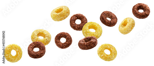 Falling chocolate corn rings isolated on white background