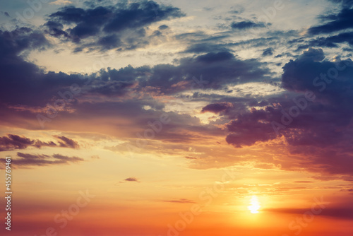 Beautiful colorful dramatic sky with clouds at sunset or sunrise