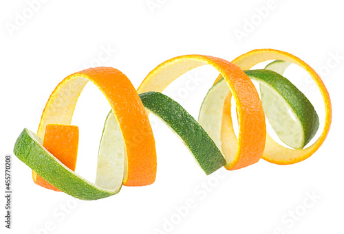 Orange and lime zest isolated on a white background. Fresh citrus fruit peel. photo