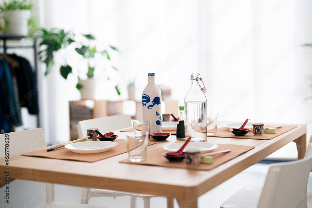 Table setting with plates and glasses Table setting with plates and glasses