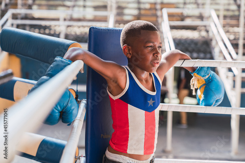 Young boxer in a boxer ring corner. photo